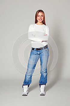Smiley young woman with folded hands