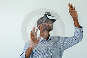 Smilign Afro american man testing VR device