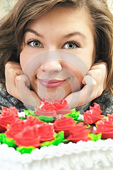 Smiliing girl near cake