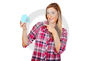 Smililing woman holding a paper house