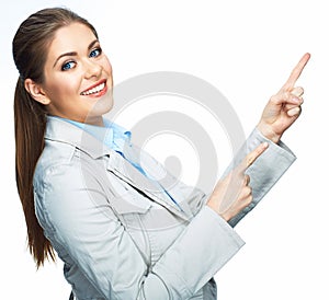 Smilinf business woman pointing on space. Isolated white