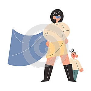 Smiling active young mother in superhero costume standing ready to defend little son