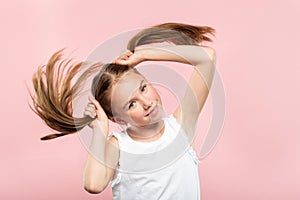 Smiling adolescent girl pig tails hair carefree