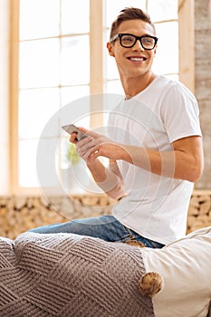 Smiling adolescent looking over his shoulder