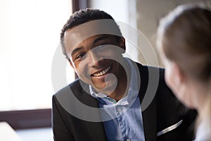 Smiling African American businessman consulting client, pleasant conversation