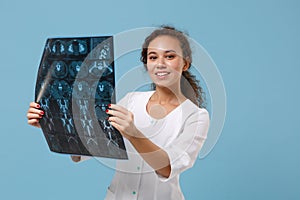 Smiling african american doctor woman in medical gown holding x-ray the brain by radiographic image ct scan mri isolated