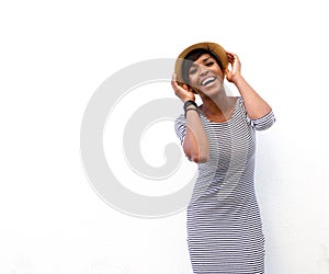 Smiling african american fashion model posing with hat