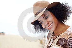 Smiling african american fashion woman with hat