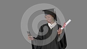 Smiling African American female graduate making selfie with diploma, Alpha Channel