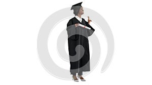 Smiling African American female student in graduation robe posing with diploma on white background.