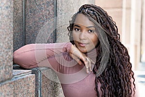 Smiling african american female young adult with braids