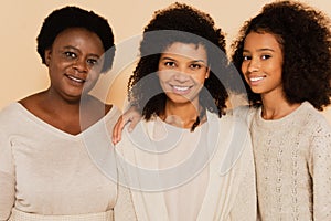 smiling african american grandmother, daughter, granddaughter