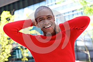 Smiling african american guy laughing