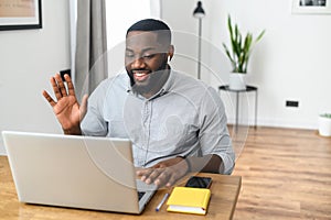 Smiling African American guy on video conference
