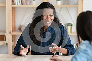 Smiling african american job seeker feeling relaxed on interview.