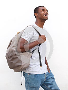 Smiling african american male college student walking