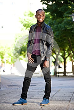 Smiling african american man in black leather jacket