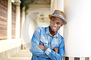 Smiling african american man relaxing with arms crossed