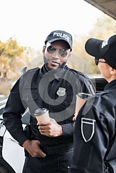 Smiling african american police officer with