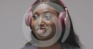 Smiling African American Woman Enjoying Music on Headphones