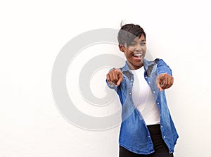 Smiling african american woman pointing fingers