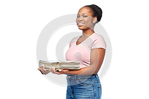 smiling african american woman sorting paper waste