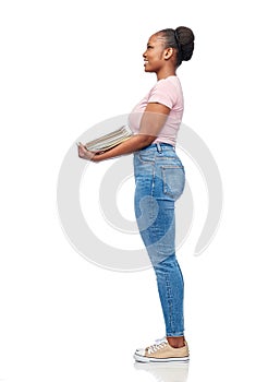 smiling african american woman sorting paper waste