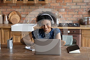 Smiling african american woman studying on online courses.