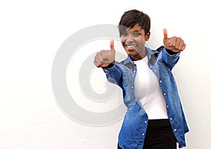Smiling african american woman with thumbs up