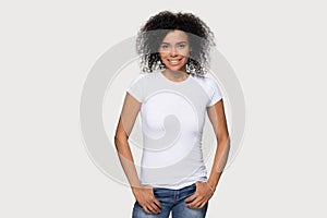 Smiling African American woman in white t-shirt front mock up photo