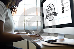 Smiling African American Woman working on Computer