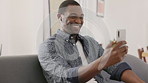 Smiling African black man doing video call