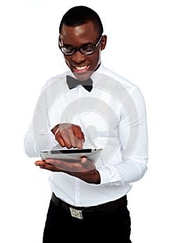 Smiling african boy using tablet-pc