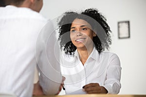 Smiling african hr interviewing job applicant, human resources m photo