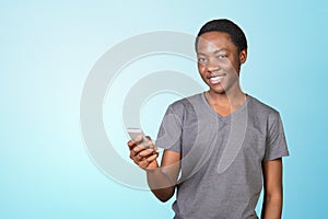 Smiling african man using smartphone