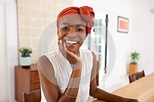 Smiling african mature woman wearing traditional headscarf
