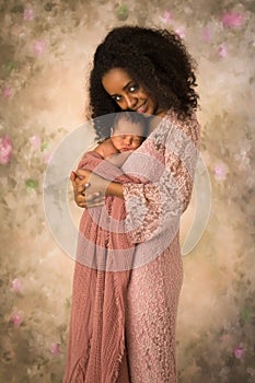 Smiling African mother with newborn baby