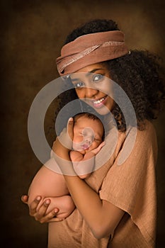 Smiling African mother with newborn baby