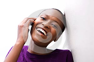 Smiling african woman talking on mobile phone