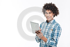 Smiling afro american man using tablet computer