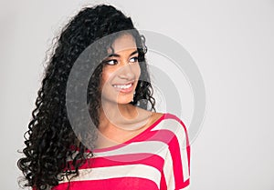 Smiling afro american woman looking away