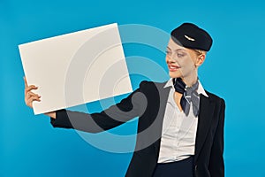 smiling air hostess in airlines uniform