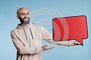 Smiling arab man blank red message frame