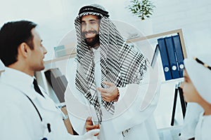Smiling Arabic Pediatrician with Muslim Family