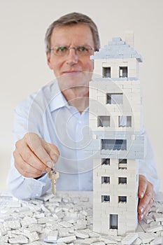 Smiling architect presenting the keys