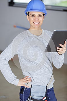 smiling architect woman working with tablet photo