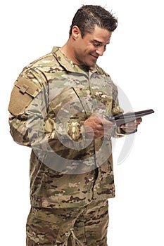 Smiling Army Soldier with tablet in hand