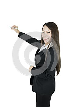 Smiling asian business woman writing something in whiteboard with pen.