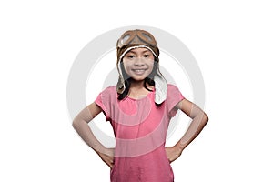 Smiling asian child in aviator helmet standing