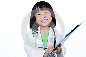 Smiling Asian Chinese Little Doctor Writting On Clip Board